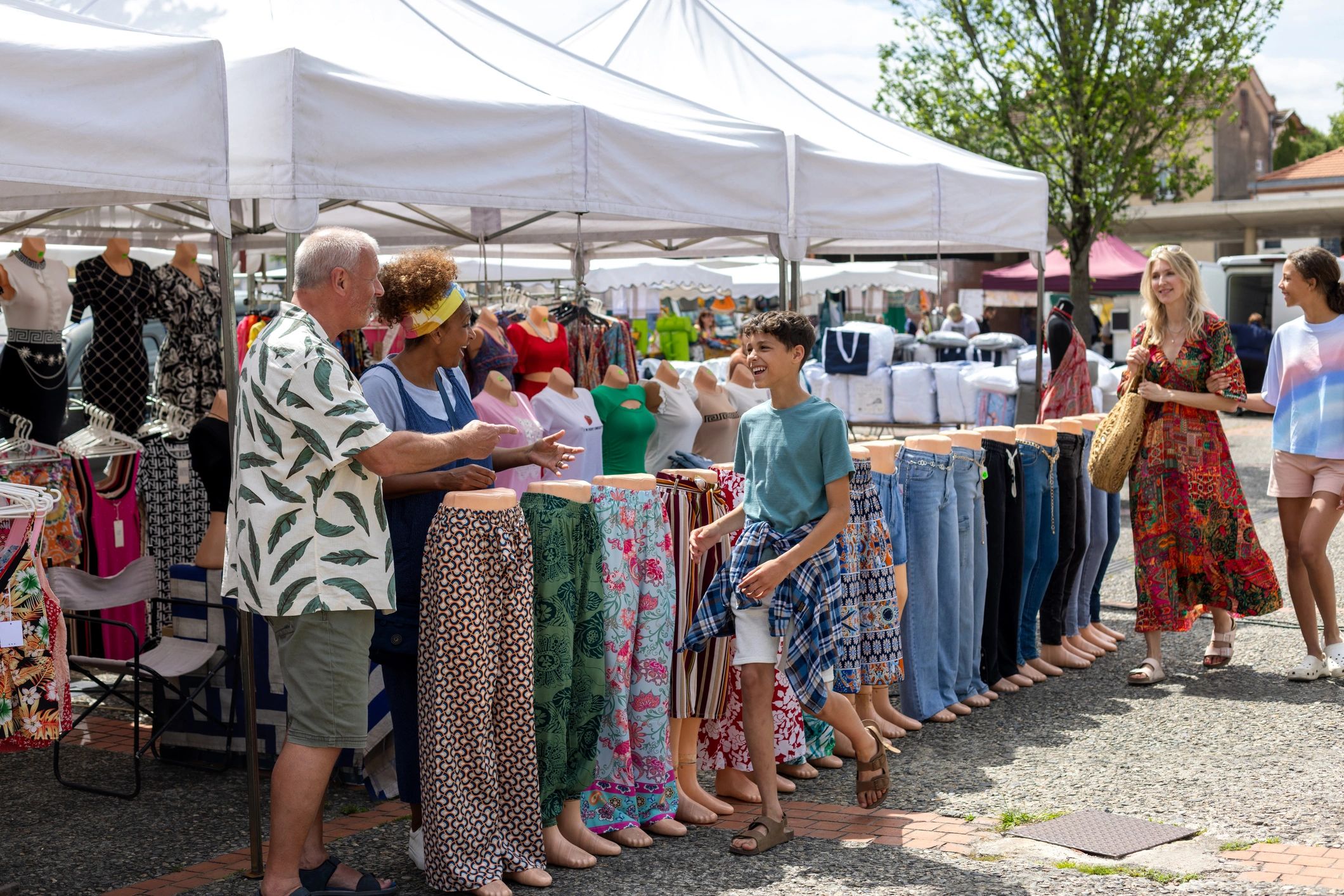 Families exploring a lively outdoor festival