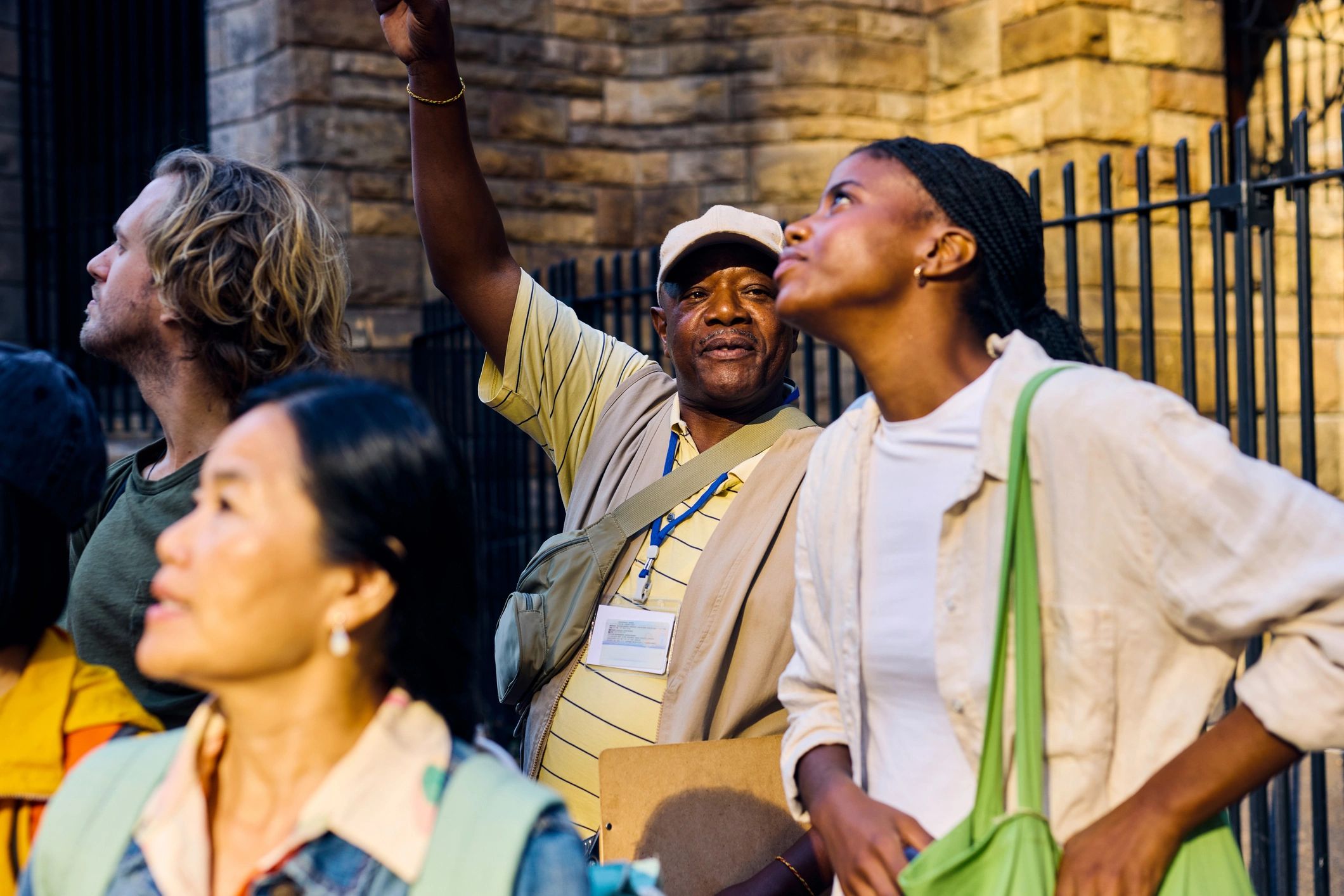 Visitors listening to a guide during a heritage-style tour